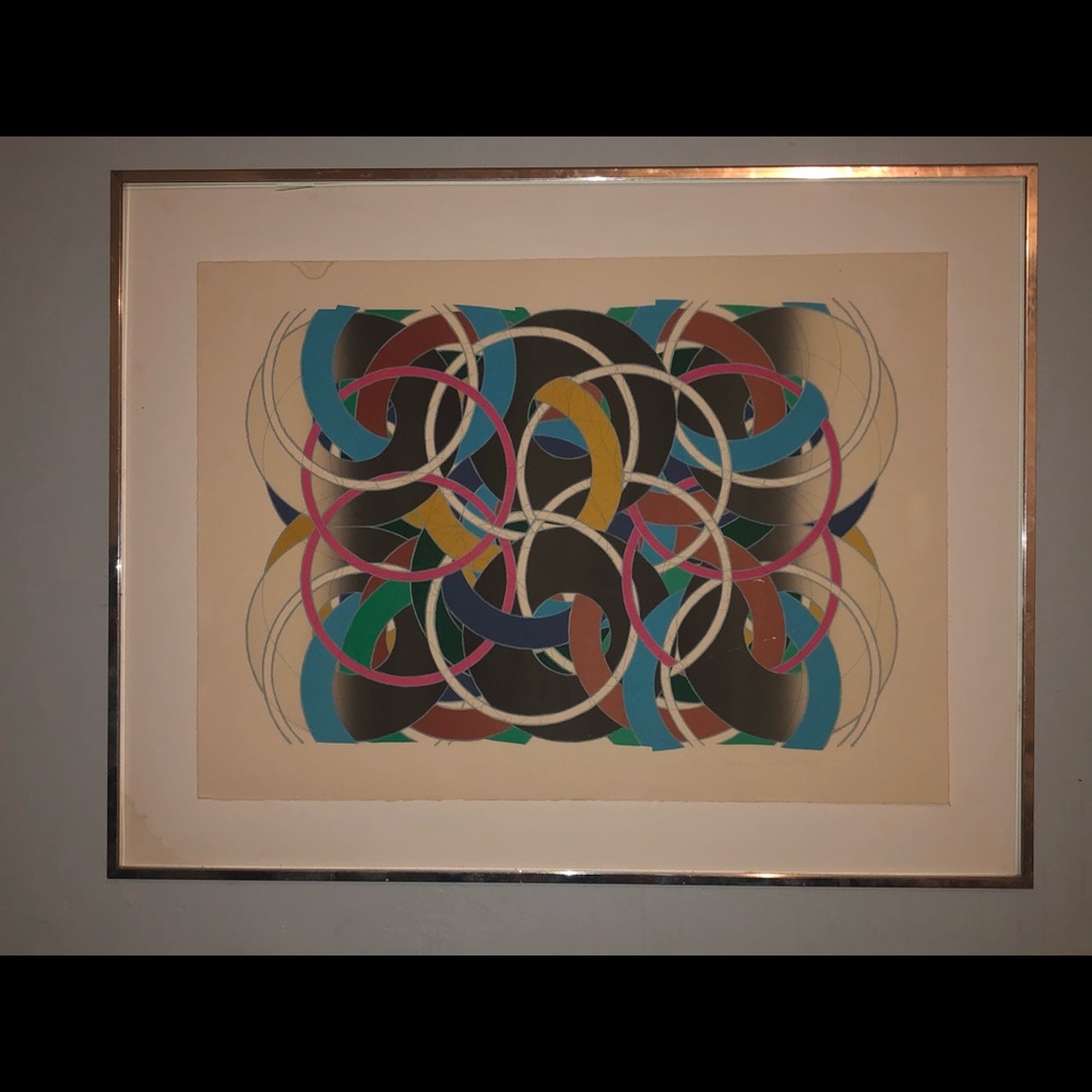 a piece of art with gold frames with no glass